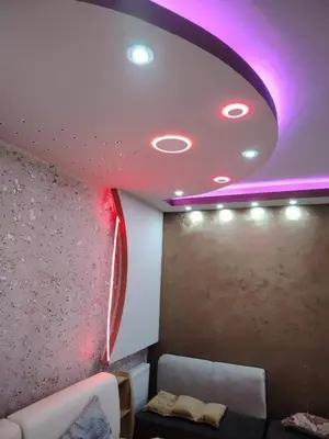 a room with a couch and a purple ceiling at mraco apartment in Amman