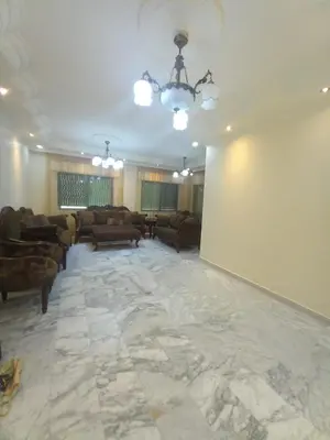 a large living room with a large marble floor at Amman Central Elegant Apartment in Amman