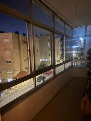 a room with a window with a view of a city at الاردن عمان الجاردنز in Amman
