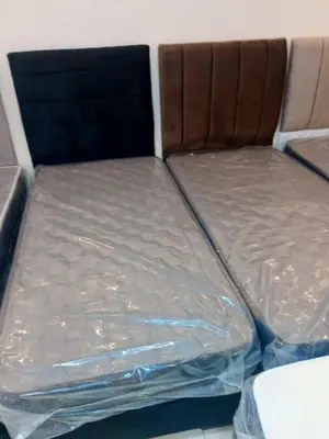 a bed in the back of a van with plastic wrap at العنبق هاوس