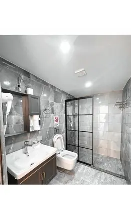 a bathroom with a toilet and a sink at RUM fAMILY lUXURY CAMP in Wadi Rum