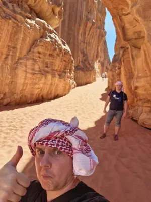 a man giving a thumbs up in the desert at saleem with jeep tour in Wadi Rum