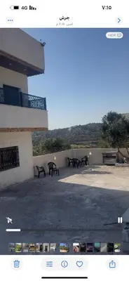 a group of benches sitting outside of a building at مزرعة وفيلا غابة الارز in Jerash