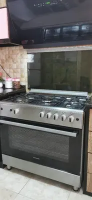 a stainless steel stove top oven in a kitchen at A big Family nice sunset flat in Amman