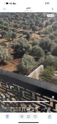 a view of a bridge with trees and bushes at فيلا مفروشه ومزرعه للايجار in Jerash