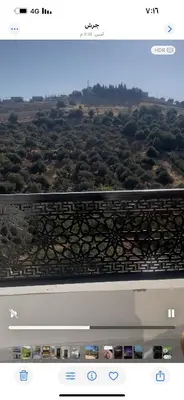 a laptop screen with a view of a city at فيلا مفروشه ومزرعه للايجار in Jerash