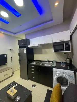 a kitchen with a sink and a washing machine at apartment 60m 1bedroom for rent4 in Amman