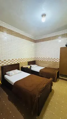 a room with three beds in a room at شقة مفروشة في عجلون in Ajloun