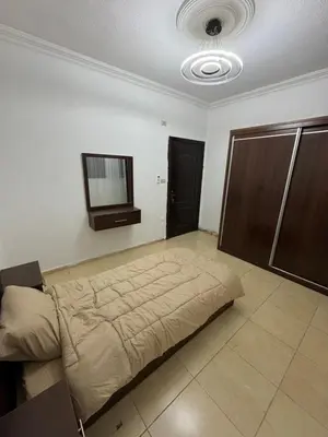 a bedroom with a large bed in a room at stay by university of Jordan in Amman