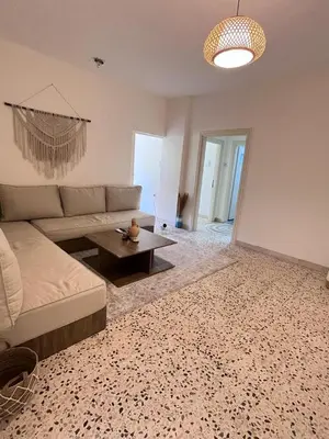 a living room with a couch and a table at White castle in Aqaba