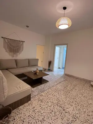 a living room with a couch and a table at White castle in Aqaba
