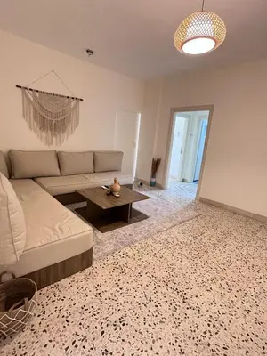 a living room with a couch and a table at White castle in Aqaba