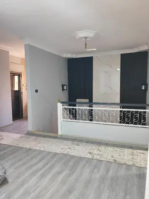 a living room with a balcony and a staircase at بيت محمد in Amman
