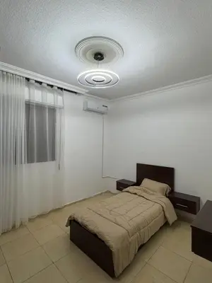 a bedroom with a bed and a ceiling at stay by university of Jordan in Amman
