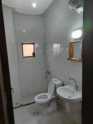 a bathroom with a toilet and a sink at الشقة الفاخرة Luxerios apartment in 0MM Nowwara in Amman