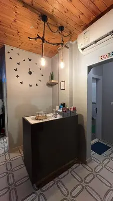 a room with a counter with bats on the wall at T Cozy Chalet in Ash Shāghūr