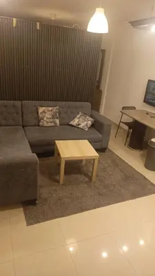 a living room with a couch and a coffee table at lNTERCoNTlNENTALAL in Amman