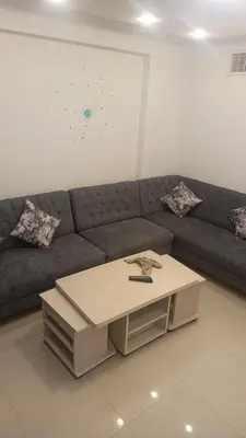 a living room with a couch and a coffee table at lNTERCoNTlNENTALALALx in Amman