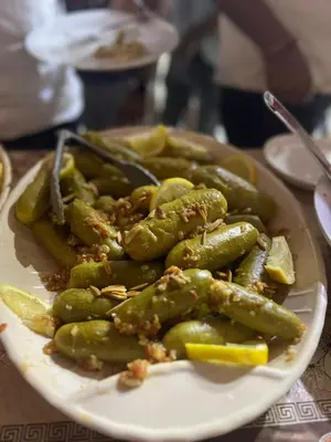 a plate of green vegetables on a table at DESERT BREATHS lUXURY CAMP in Wadi Rum