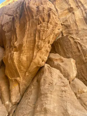 a rock wall in the middle of a desert at Shadow of Rum camp in Wadi Rum