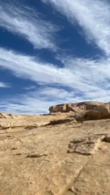 a view of a desert with a blue sky and clouds at Shadow of Rum camp in Wadi Rum