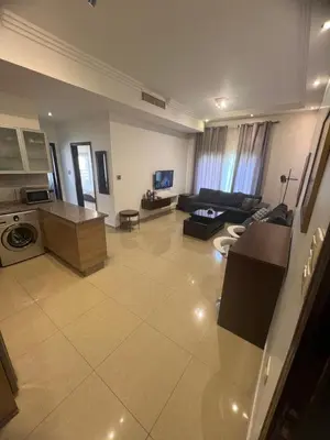 a large living room with a couch and a table at عبدون الشمالي in Amman