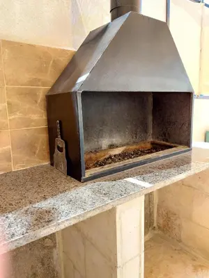 a grill sitting on top of a counter at sama vailla in Amman