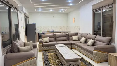 a living room with a couch and a table at شالية جوهرة جراسيا Jewel of Gracia Chalet in Jerash