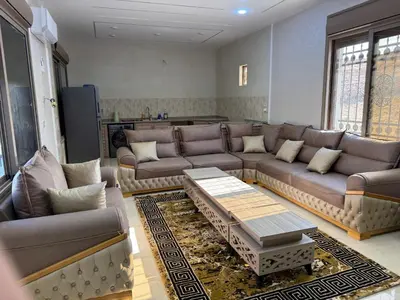 a living room with a couch and a coffee table at شالية جوهرة جراسيا Jewel of Gracia Chalet in Jerash