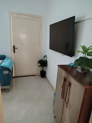 a living room with a flat screen tv on a wall at العقبه in Aqaba