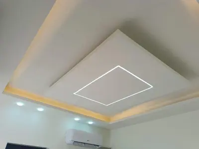 a ceiling with a large light in a room at شاليه ومزرعة طبقة فحل Chalet Pella