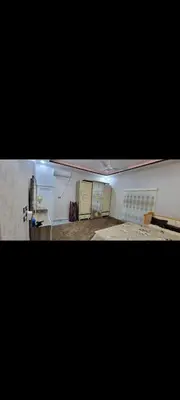 two pictures of a room with a kitchen and a room with at شقة مفروشة للإجار in Ar Ramthā