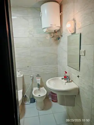a bathroom with a sink and a toilet at EVANNA SUITE AND HOTELs ايفانا للشقق الفندقيه و المفروشه in Amman