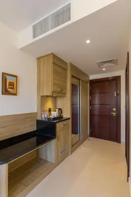 a kitchen with wooden cabinets and a black counter top at Petra Legacy Luxury in Petra