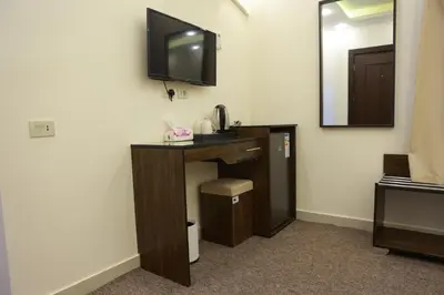 a room with a bathroom with a sink and a mirror at Petra Brothers in Petra