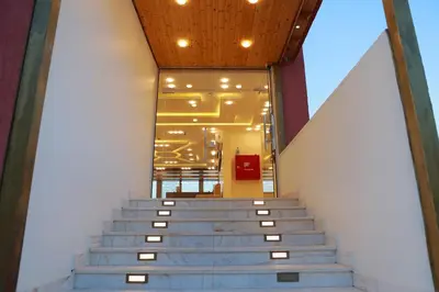 a set of stairs in a building with a window at Petra Brothers in Petra