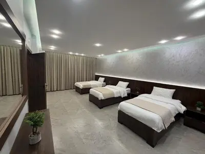 a hotel room with two beds in a room at Taj Villa 2 - entire Villa in Deadsea front beach in Sowayma