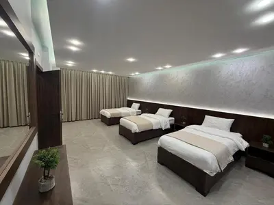 a hotel room with two beds in a room at Taj Villa 2 - entire Villa in Deadsea front beach in Sowayma