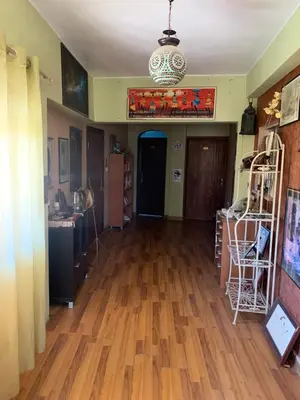 a living room with a hard wood floor at Monastery in Wadi Musa