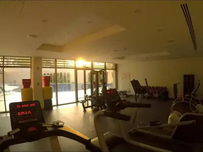 a gym with treadmills and exercise bikes in a room at قرية الراحة باطلالة بحرية-مرسى زايد-Alraha village -marsa zayed- with sea view in Aqaba