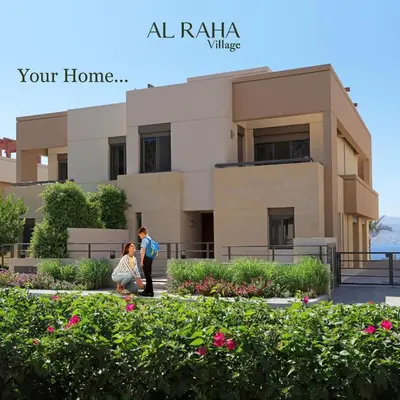 a man and a woman standing in front of a building at قرية الراحة باطلالة بحرية-مرسى زايد-Alraha village -marsa zayed- with sea view in Aqaba