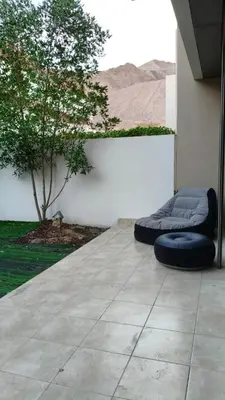 a bed sitting on the side of a building at Al-Raha Luxury apartment in Aqaba