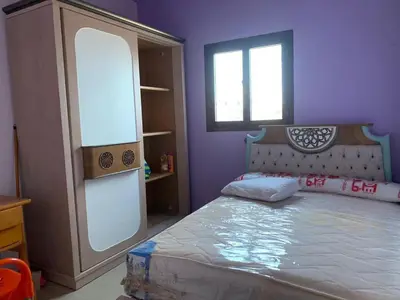 a bedroom with a bed and a window at Jorh BB in Amman