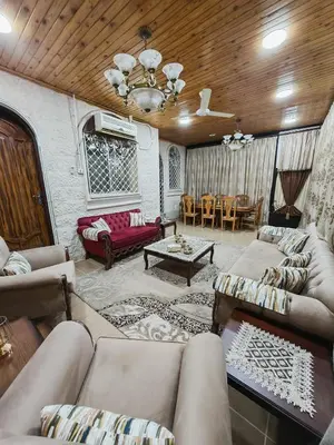 a living room with couches and a table at Luxury Apartments in Aqaba