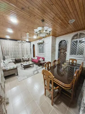 a large living room with a wooden ceiling at Luxury Apartments in Aqaba