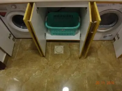 a laundry room with a washer and a washing machine at Ammoun Luxury Apartments 1 in Amman