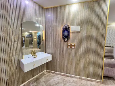a bathroom with a sink and a mirror at مزرعة وشاليه ادم