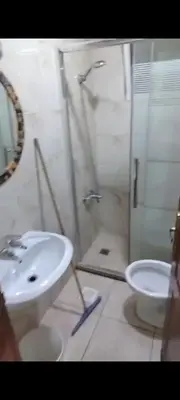 a bathroom with a sink and a shower at شقه مفروشه in Amman