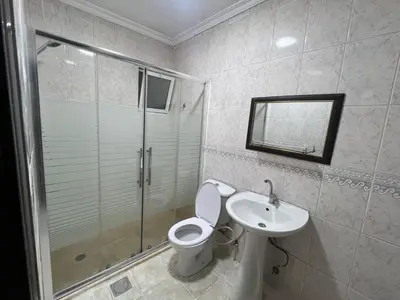a bathroom with a toilet and a sink and a shower at شقه مفروشه in Amman