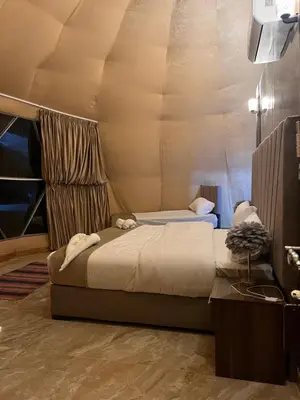 a bedroom with two beds in a room at Sand Desert Camp in Wadi Rum